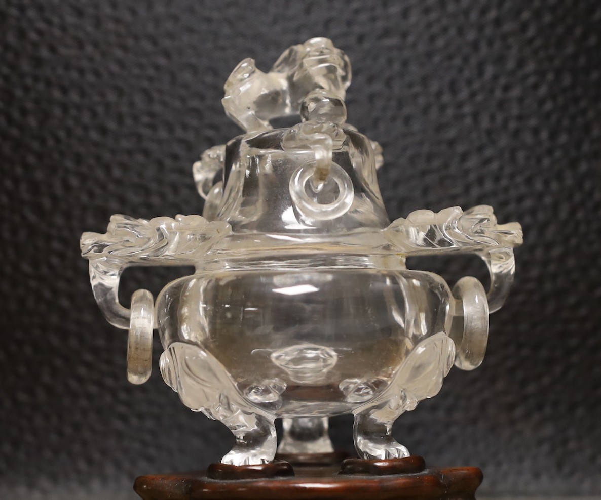 A Chinese rock crystal tripod censer and cover, on hardwood stand, 11cm